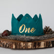 Load image into Gallery viewer, Teal knitted crown with One in gold lettering and gold accents