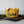 Load image into Gallery viewer, Gold knitted crown with Caleb in black lettering and gold accents
