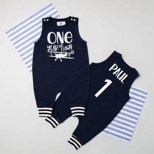 "One Year Has Flown By" Airplane First Birthday Romper with Striped Cuff