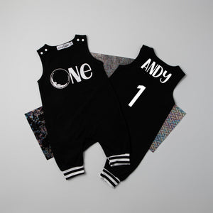 Black "One" Space Themed First Birthday Romper with Striped Cuff