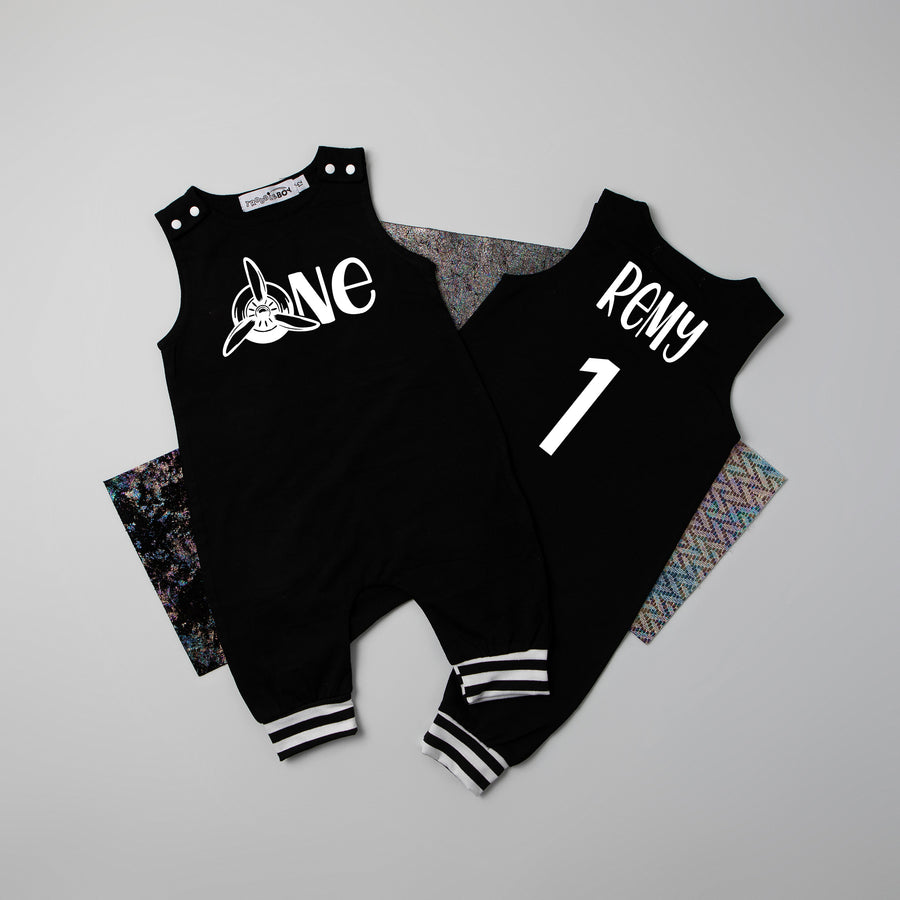 Black "One" Airplane First Birthday Romper with Striped Cuff