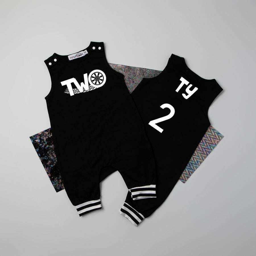 Black "Two" Racecar Second Birthday Romper with Striped Cuff