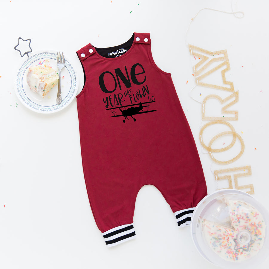 Gray "One Year Has Flown By" Airplane Themed Birthday Romper with Striped Cuff