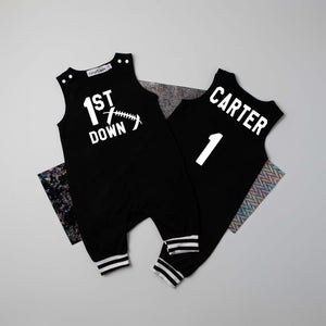Black "1st Down" Football First Birthday Romper with Striped Cuff